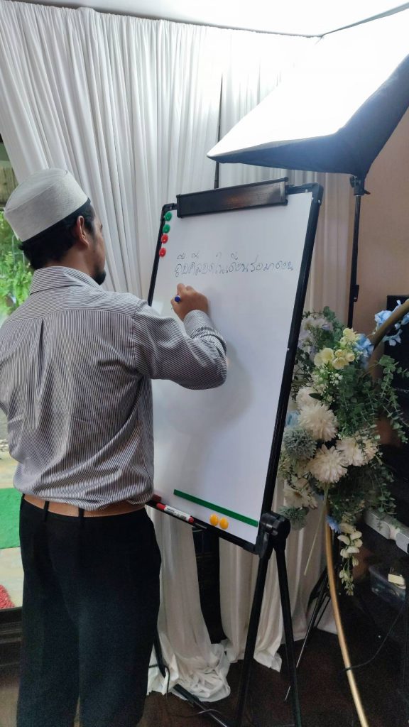 An instructor guiding a learner at ARAYA House